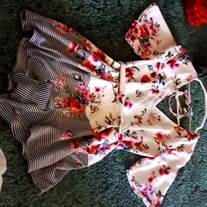 A romper shorts and ties and zips in the back it's a size xs